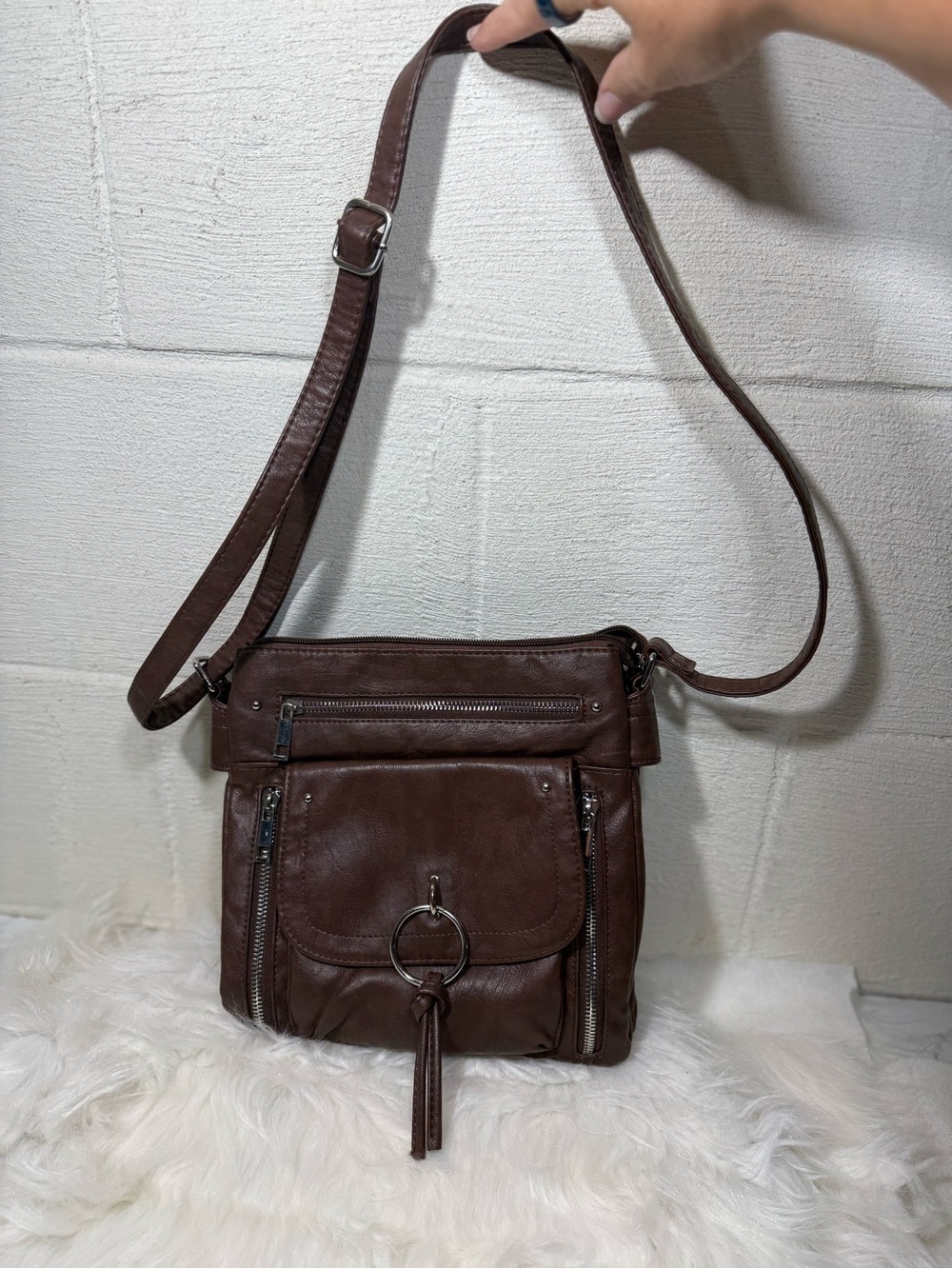 Classic Brown Leather Crossbody Bag with Tassel Ring Accent